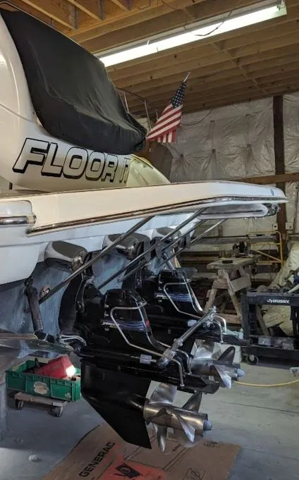 Slide: The Image of Rear view of a 2005 Formula 370 Super Sport boat in a workshop. - 10