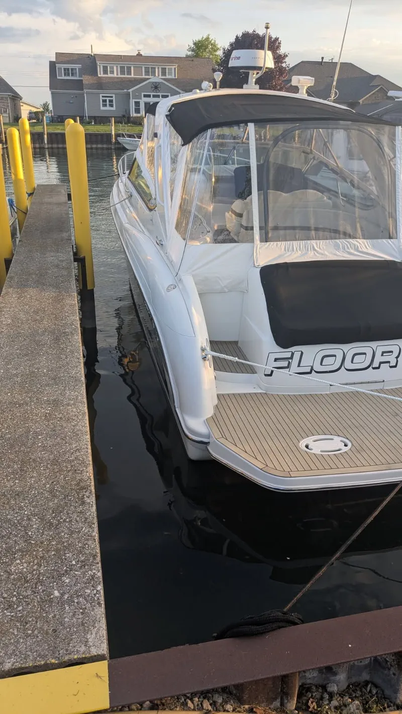 Slide: The Image of 2005 Formula 370 Super Sport boat docked at marina. - 18