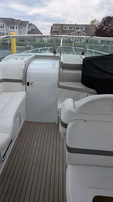 Slide: The Image of Interior of a 2005 Formula 370 Super Sport yacht with white seating. - 23