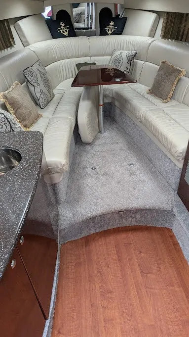 Slide: The Image of Interior of a 2005 Formula 370 Super Sport with elegant upholstery and a wooden table. - 14