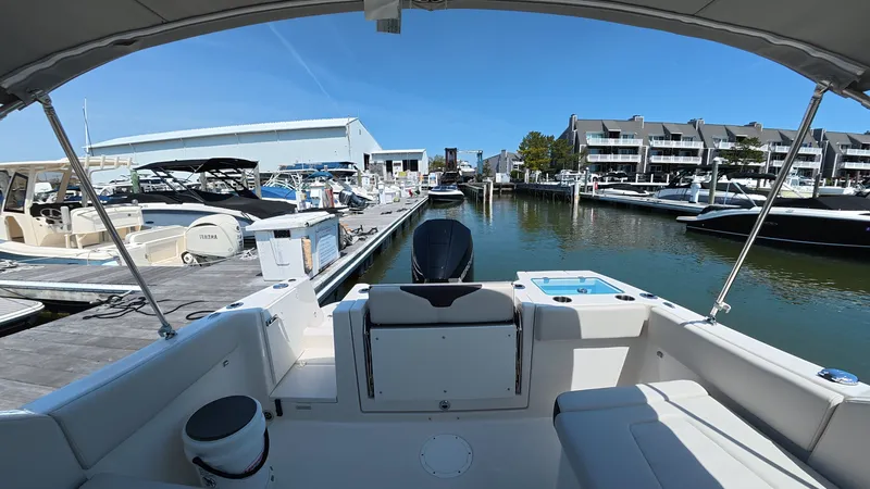 Slide: The Image of Interior view of a 2024 Sailfish 226 DC boat at the marina. - 10