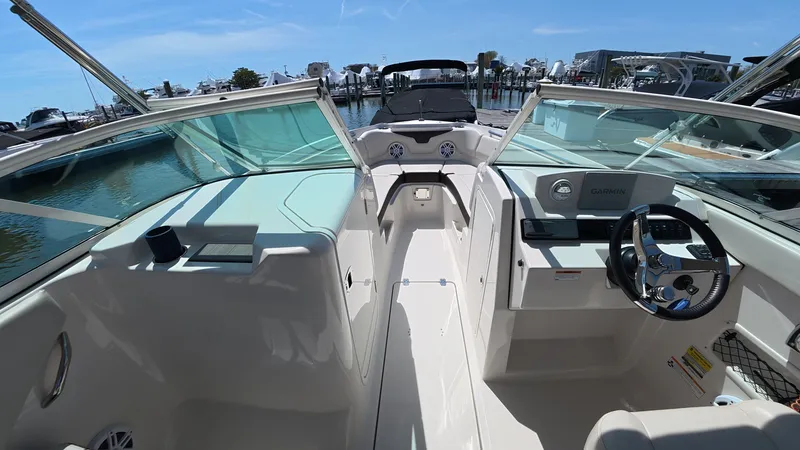 Slide: The Image of Interior view of the 2024 Sailfish 226 DC boat at the marina. - 25