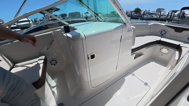 Slide: The Image of Interior of 2024 Sailfish 226 DC with seating area and speakers. - 26