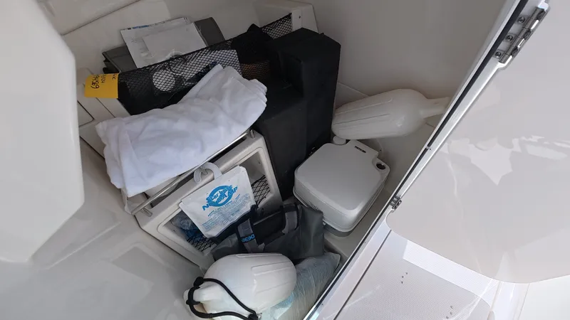 Slide: The Image of Storage area in 2024 Sailfish 226 DC boat with accessories. - 27
