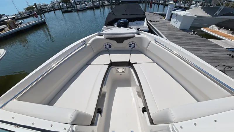 Slide: The Image of 2024 Sailfish 226 DC boat with luxurious interior at dock. - 30