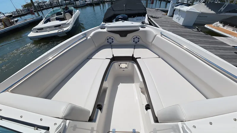 Slide: The Image of 2024 Sailfish 226 DC boat with spacious seating area at the dock. - 31