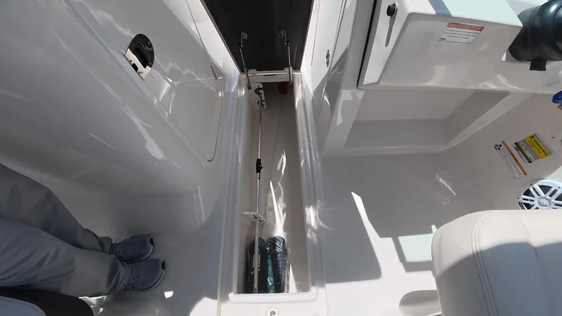 Slide: The Image of Interior of 2024 Sailfish 226 DC boat with storage compartment. - 33