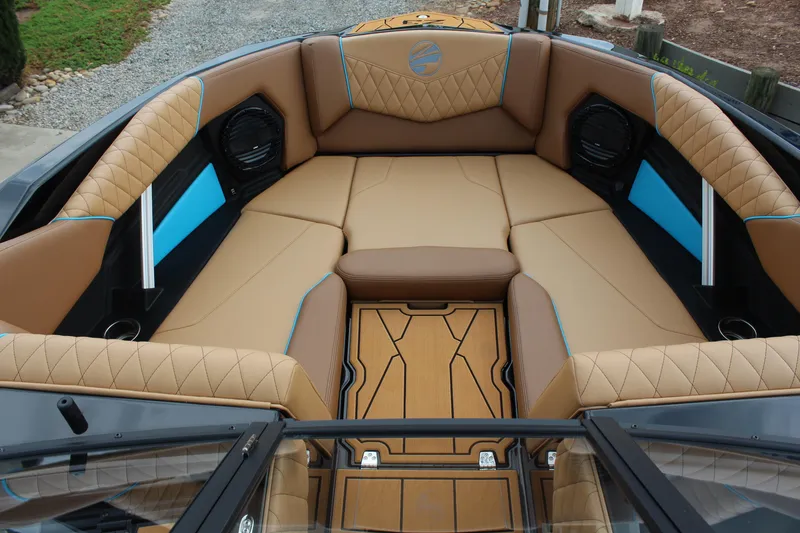 Slide: The Image of Luxurious interior of 2026 Tigé Z3 boat with tan and blue seating. - 15