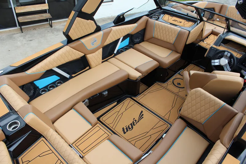 Slide: The Image of Luxurious interior of 2026 Tigé Z3 boat with tan and blue accents. - 10