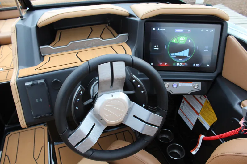 Slide: The Image of 2026 Tigé Z3 boat dashboard with touchscreen display and modern steering wheel. - 12