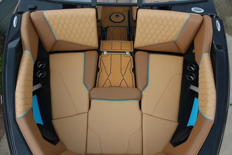 Slide: The Image of Luxurious interior of 2026 Tigé Z3 boat with tan and blue upholstery. - 16