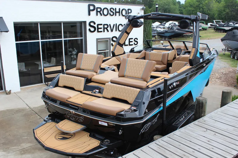 Slide: The Image of 2026 Tigé Z3 boat with luxurious seating at a dealership. - 3