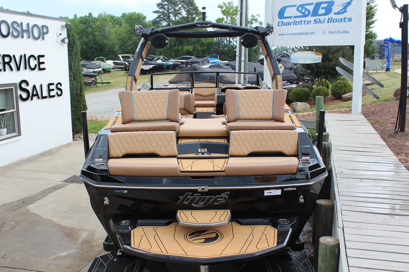 Slide: The Image of 2026 Tigé Z3 boat at Charlotte Ski Boats dealership, showcasing luxury seating and sleek design. - 4