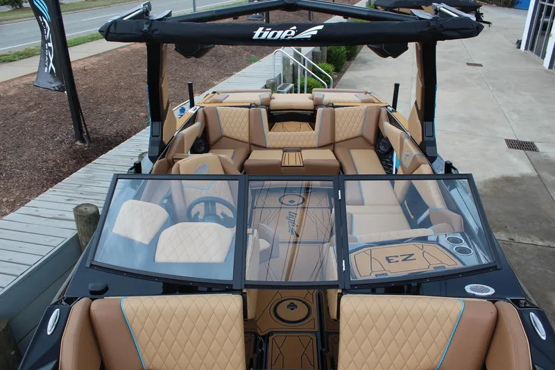 Slide: The Image of 2026 Tigé Z3 boat interior with tan upholstery and modern design features. - 17