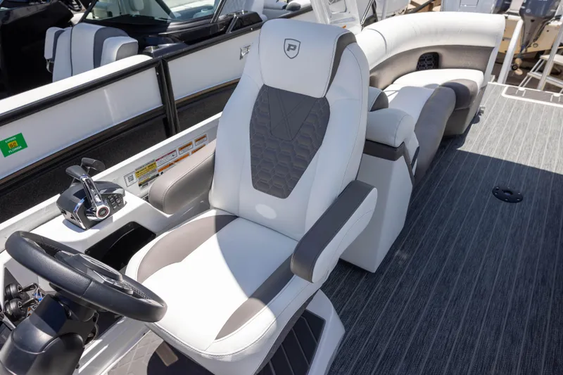 Slide: The Image of Luxurious interior of 2026 Premier 270 Intrigue RF - CL boat with plush seating and modern controls. - 12