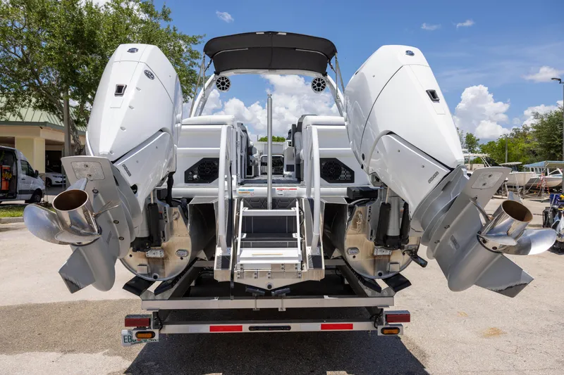 Slide: The Image of Rear view of 2026 Premier 270 Intrigue RF - CL boat with dual outboard motors. - 5