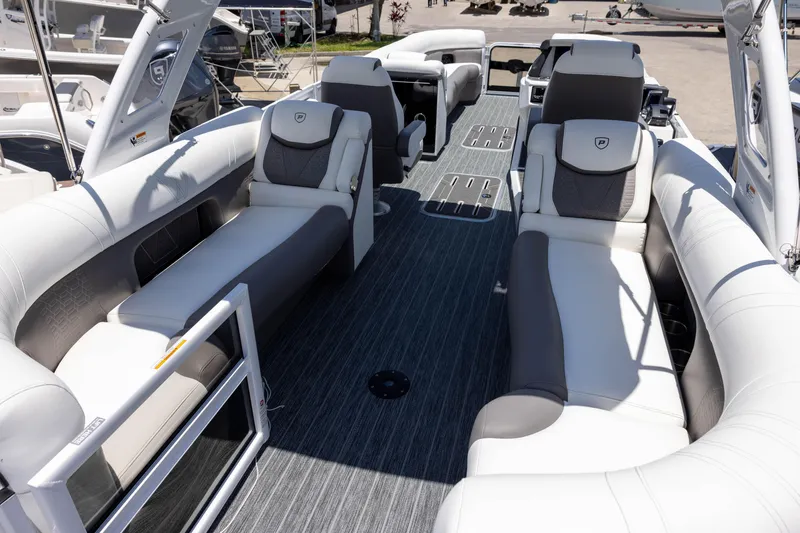 Slide: The Image of Luxurious interior of 2026 Premier 270 Intrigue RF - CL pontoon boat with plush seating. - 7