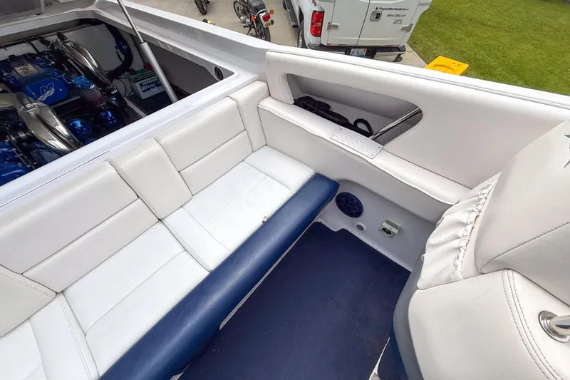 Slide: The Image of Interior of a 2005 Donzi 38 ZR boat with white and blue seating. - 17