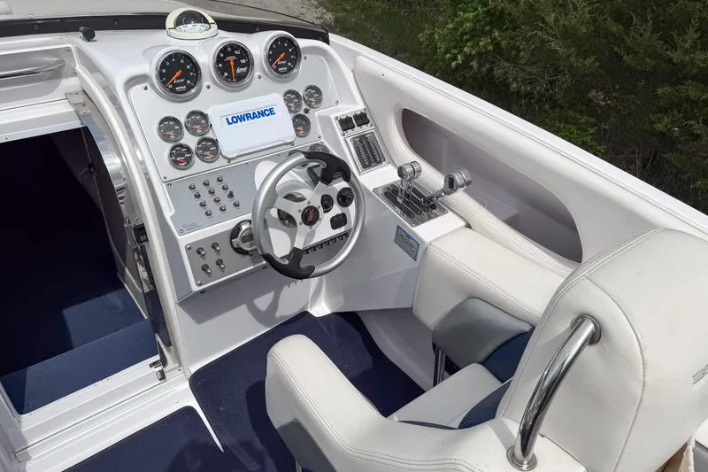 Slide: The Image of Cockpit of 2005 Donzi 38 ZR boat with steering wheel and control panel. - 19