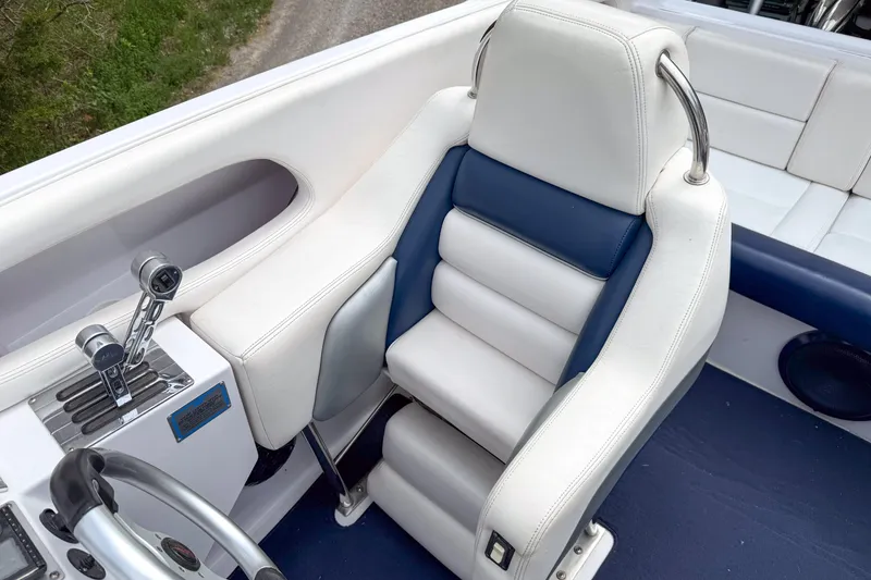 Slide: The Image of Cockpit of 2005 Donzi 38 ZR boat with white and blue seating. - 22