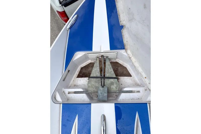 Slide: The Image of 2005 Donzi 38 ZR boat anchor compartment with blue and white detailing. - 26