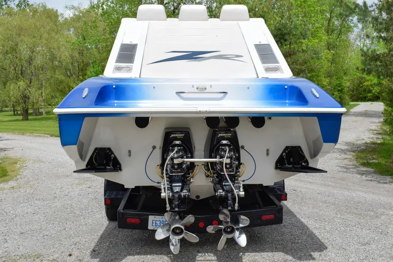 Slide: The Image of Rear view of a 2005 Donzi 38 ZR boat with dual Mercury engines. - 5