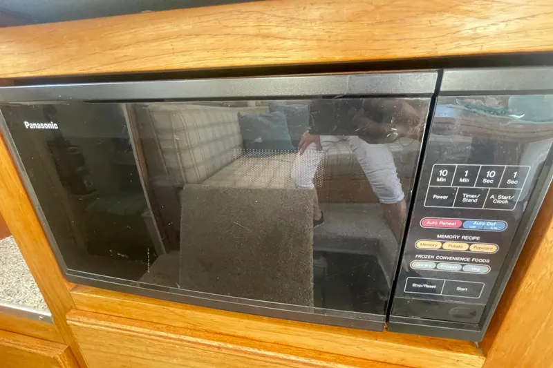Slide: The Image of Panasonic microwave in a 1974 Tollycraft 37 Sedan boat kitchen setup. - 20