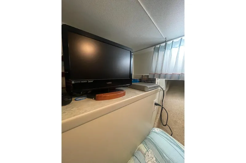 Slide: The Image of Television setup inside a 1974 Tollycraft 37 Sedan boat cabin. - 37