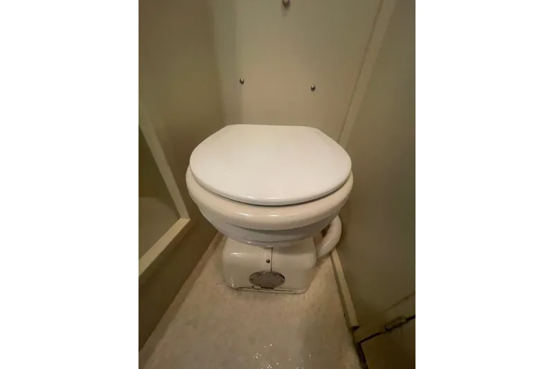 Slide: The Image of 1974 Tollycraft 37 Sedan boat toilet, compact marine bathroom fixture. - 40