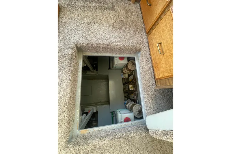 Slide: The Image of Engine compartment of 1974 Tollycraft 37 Sedan with carpeted floor. - 45
