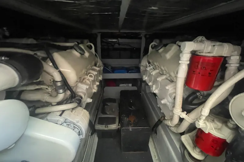 Slide: The Image of Engine room of a 1974 Tollycraft 37 Sedan with visible components and filters. - 46