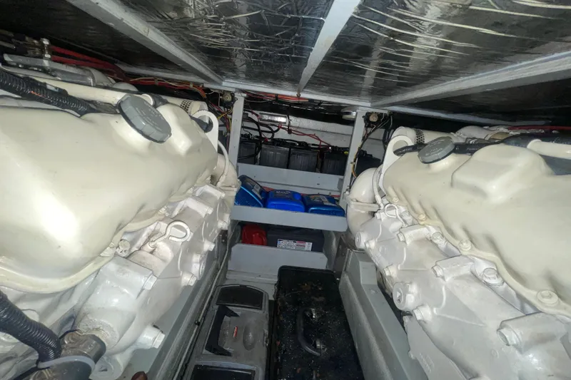 Slide: The Image of Engine room of a 1974 Tollycraft 37 Sedan with visible components and wiring. - 50