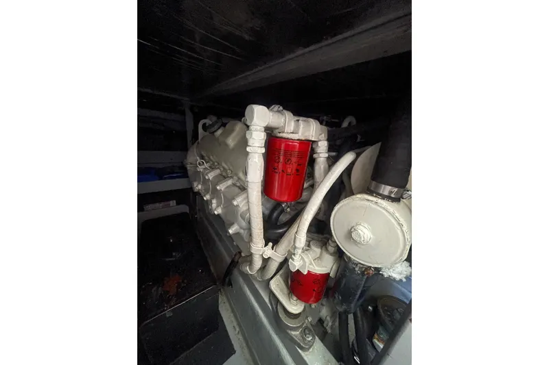 Slide: The Image of Engine compartment of a 1974 Tollycraft 37 Sedan with visible red filters. - 51