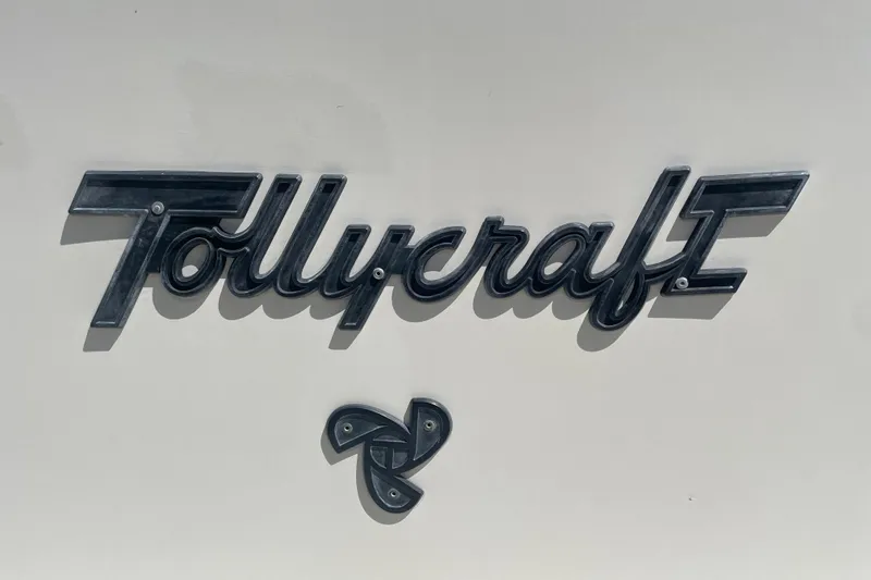 Slide: The Image of 1974 Tollycraft 37 Sedan logo on boat exterior. - 53