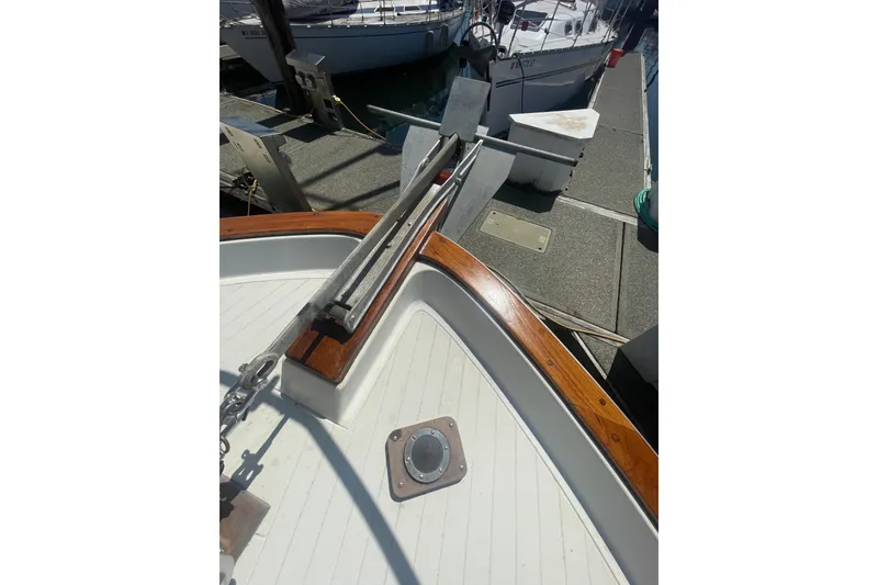 Slide: The Image of 1974 Tollycraft 37 Sedan boat deck with anchor and wooden trim. - 6