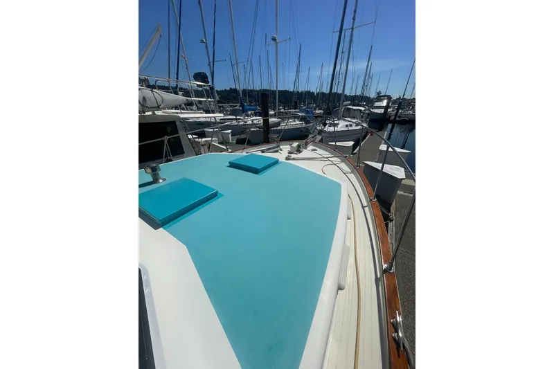Slide: The Image of 1974 Tollycraft 37 Sedan yacht docked at marina under clear blue sky. - 7