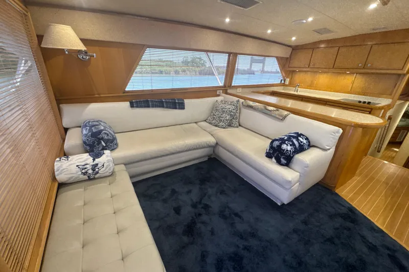 Slide: The Image of Luxurious interior of a 1997 Bertram 54 Convertible yacht with plush seating and elegant decor. - 14