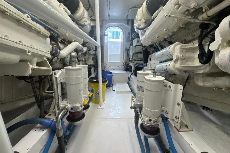 Slide: The Image of Engine room of a 1997 Bertram 54 Convertible yacht, showcasing machinery and components. - 35