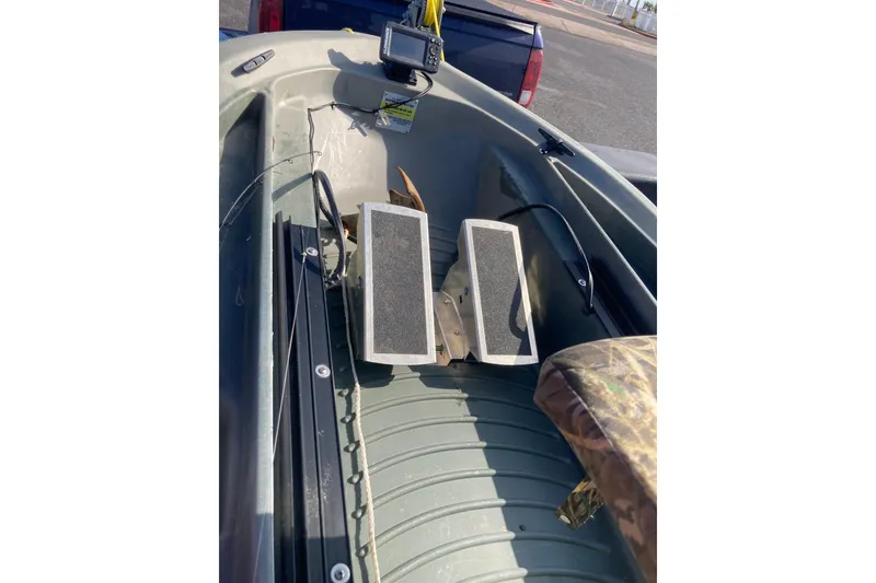 Slide: The Image of 2023 Freedom Twin Troller X10 interior with foot pedals and control panel. - 4