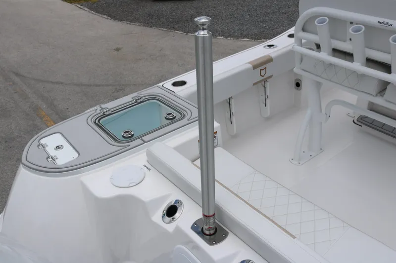 Slide: The Image of 2026 Sea Fox 228 Commander boat interior with rod holders and storage compartments. - 11