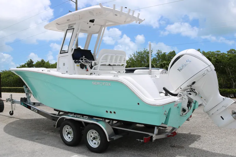 Slide: The Image of 2026 Sea Fox 228 Commander boat on trailer, featuring a sleek design and powerful engine. - 3