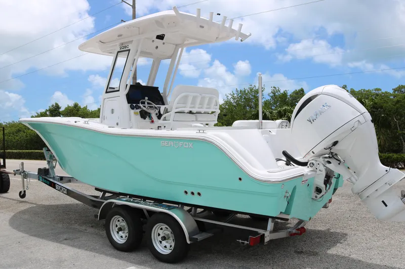 Slide: The Image of 2026 Sea Fox 228 Commander boat on trailer, featuring a sleek design and Yamaha engine. - 4