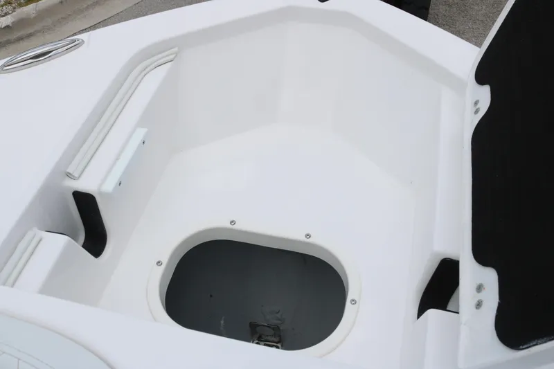 Slide: The Image of 2026 Sea Fox 228 Commander boat storage compartment, white interior, open hatch. - 6