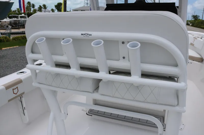 Slide: The Image of 2026 Sea Fox 228 Commander boat with rod holders and cushioned seating. - 7
