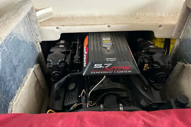 Slide: The Image of Engine compartment of a 1998 Crownline 248 BR boat with 5.7L Thunderbolt ignition. - 10