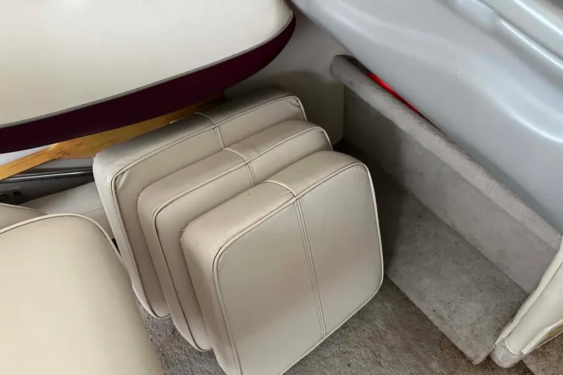 Slide: The Image of Cushions inside a 1998 Crownline 248 BR boat, showcasing interior seating arrangement. - 12