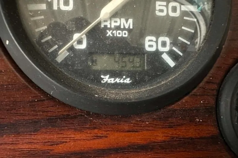 Slide: The Image of Close-up of a Faria RPM gauge on a 1998 Crownline 248 BR boat dashboard. - 14