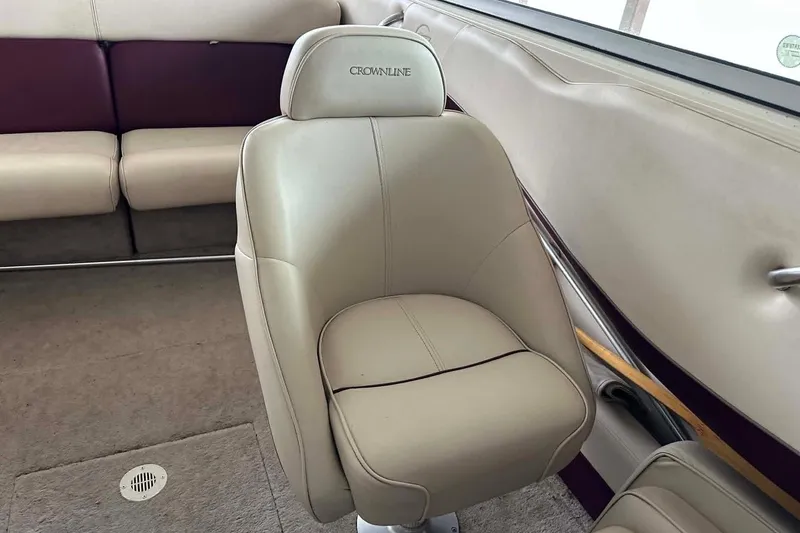 Slide: The Image of Interior of a 1998 Crownline 248 BR boat with beige seating. - 8