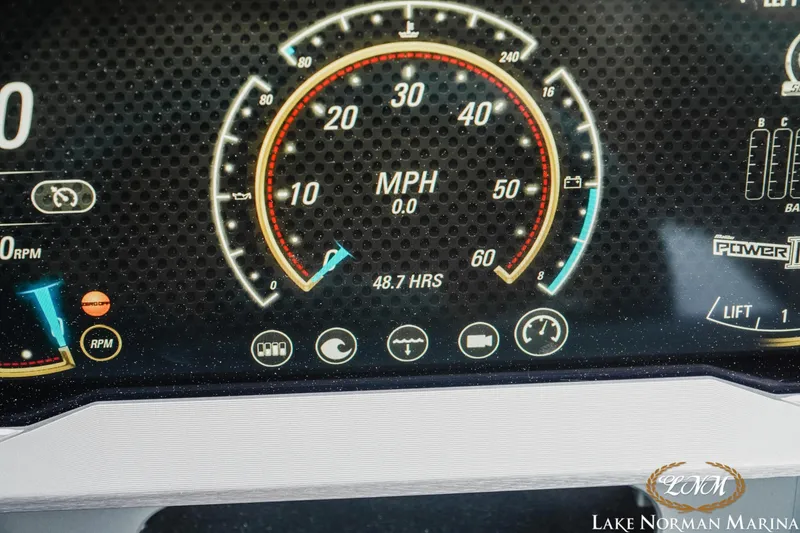 Slide: The Image of Dashboard of a 2021 Malibu M240 boat showing speedometer and various gauges. - 24