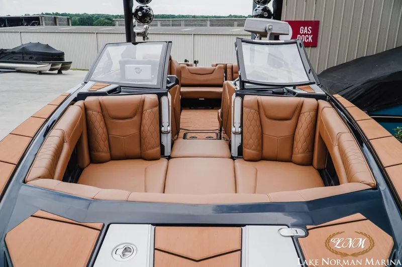 Slide: The Image of 2021 Malibu M240 boat with luxurious tan leather seating at Lake Norman Marina. - 4